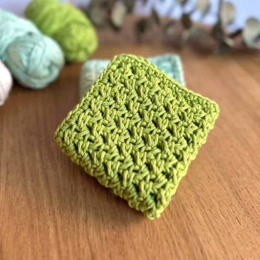 green crochet washcloth folded