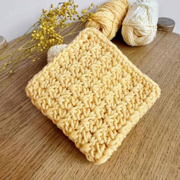 yellow crochet dishcloth folded